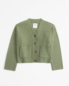 Wrap yourself in cozy sophistication with the Abercrombie & Fitch Women's Waffle Cardigan. This charming green cardigan is a perfect blend of comfort and style, crafted from a soft sweater yarn that includes polyester, nylon, and acrylic for a luxurious feel.

- Size: Medium
- Color: Green
- Material: Polyester, Nylon, Acrylic
- Gender: Female
- Age Group: Adult
- Features: All-over textural waffle stitch, button-up front, rib trims

Ideal for layering, this cardigan can be styled open over a ba Casual Waffle Knit Cardigan For Winter, Winter Casual Waffle Knit Cardigan, Casual Winter Waffle Knit Cardigan, Casual Knit Outerwear With Waffle Knit, Relaxed Fit Knit Cardigan With Buttons, Waffle Knit Outerwear For Layering, Casual Textured Sweater For Fall, Knit Cardigan With Buttons In Relaxed Fit, Knit Cardigan With Buttons And Relaxed Fit