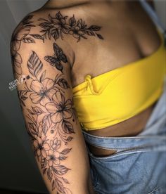 a woman's arm with flowers on it