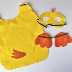 a child's bib and mask are on the table