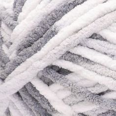 a pile of gray and white yarn