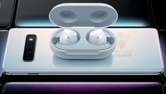 an apple airpods sitting on top of a phone