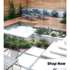 an outdoor hot tub in the middle of a patio with chairs and plants around it