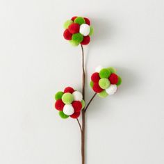 This whimsical spray features balls of pom poms that will add an eye-catching pop of color to your holiday decor. The red, green and white pom pom spray features a cheerful mix of colors that conjures feelings of cozy Christmas mornings and a holly jolly mood. The exclusive design is perfect for adding to arrangements, wreaths and table centerpieces for a playful dose of festive flair. Sprinkle a little festive cheer with this unconventional, stylish spray. Christmas Tree Picks, Novelty Decor, Christmas Stem, Charity Gifts, Target Holiday, Christmas Picks, Cabin Christmas, Holiday Store, Indoor Christmas Decorations