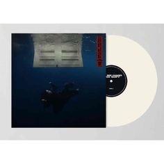 a white vinyl record with an image of a scuba diver in the water