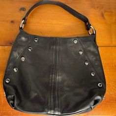 B. Makowsky Black Studded Leather Hobo Bag Excellent Preowned Condition. Very Slight Scrape On Right Side Near Zipper - See Image. 2 Zipper Pockets Outside, 1 Zipper Pocket Inside, 2 Open Pockets Inside Animal Print Lining Inside Genuine Leather Measurements: 13” Long 18” Wide Black Leather Hobo Bag With Snap Closure, Black Hobo Shoulder Bag With Zipper Closure, Leather Hobo Bag With Silver-tone Hardware, Black Textured Leather Hobo Bag For On-the-go, Black Leather Hobo Bag With Silver-tone Hardware, Studded Purse, Leather Hobo Bag, Studded Leather, Leather Hobo