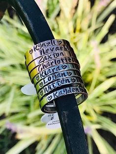 "The perfect gift!  Personalized stackable rings.  Each ring is 3mm wide and made from stainless steel so no turning!  Available in silver, gold, and rose gold.  I can do hearts, names, dates, Roman numerals, coordinates, or if you have something else in mind just shoot me a message and we will see what we can do!!   Please be sure to leave all personalized information in the note to seller section when checking out   Make sure you type it in EXACTLY how you want it to be read (all lowercase, all uppercase, name then heart, etc.) as that is how I will do it.  For example:  \" Jody (heart) \"  \" molly jo \" \" LOGAN \" \" nathan (heart) molly \" If you have any questions please feel free to message me!" Personalized Stackable Rings, To Be Read, Personalized Rings, Upper Case, Something Else, Roman Numerals, Stackable Rings, Silver Gold, Dates