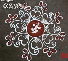 this is an image of a flower design on the ground with white and red colors