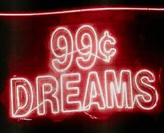 a neon sign with the words 99 cents and dreams written in white letters on it