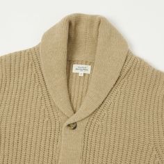 When it comes to luxurious knitwear, it's hard to beat Hartfords selection. Knitted using a thick 100% wool which is both warming and superbly soft, this shawl collared cardigan boasts fantastic detailing including ribbed detailing and pared down, tortoiseshell buttons. This timeless piece will see you through many a season, in both comfort and style. 100% Wool Shawl collar Ribbed detailing Tortoiseshell buttons Product code: BAQ6317-03 Luxury Wool Collared Cardigan, Luxury Workwear Cardigan With Buttoned Pockets, Luxury Collared Cardigan For Workwear, Luxury Ribbed Collar Cardigan For Workwear, Workwear Boots, Rib Cardigan, Denim Repair, Collared Cardigan, Thick Cardigan