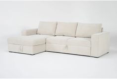 a white sectional couch with storage underneath it