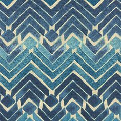 blue and white chevroned fabric with an interesting pattern on the bottom half of it