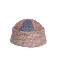 Sometimes called the dockers hat, the beanie has rugged workwear associations. This is a more sophisticated version. It has a deeper crown for a more flattering fit, And it is made in a a combination of three beautiful herringbone fabrics, as attractive for men as for women. 100% wool. Lining 100% cotton. Dry clean only Brown Wool Knitted Hat, Brown Wool Knitted Beanie, Brown Wool Six-panel Hat, Brown Wool Flat Cap, Brown Hand-knitted Beanie, Herringbone Fabric, Mens Beanie, Ethical Brands, Summer Color Palette