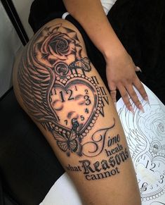 a woman's leg with a tattoo on it and an image of a clock