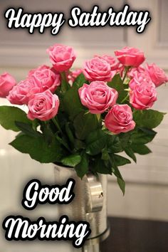 a vase filled with pink roses on top of a table