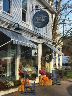 the country store is decorated with pumpkins and hay