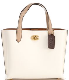 From COACH&#x2C; the Willow 24 Faded Leather Tote Bag features: Polished pebble leatherTurn-lock and magnetic snap closuresCenter zip compartmentDouble handlesDetachable strap for shoulder or crossbody wearFour protective feet at the baseApprox. 9.5" L x 7.75" H x 4.25" W bag; 4.5" handle drop; 21.5" strap drop Imported. Luxury Monogram Canvas Tote Satchel, Luxury Michael Kors Coated Canvas Shoulder Bag, Classic Cream Bag With Turn-lock Closure, Leather Cream Bags With Turn-lock Closure, White Pebbled Leather Bag With Gold-tone Hardware, Cream Leather Bag With Turn-lock Closure, Coach Willow, Coach Tote Bags, Polished Pebble