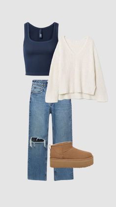 a pair of jeans, sweater and booties is featured in this image with the same outfit