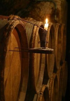 a candle that is sitting on some barrels