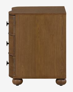 a wooden cabinet with three drawers and four knobs on the front, side view