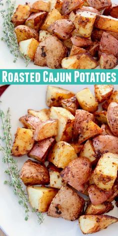 two plates filled with cooked cajun potatoes on top of a wooden table next to an oven