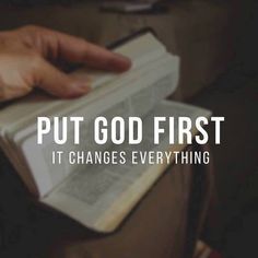 a person holding an open book with the words put god first it changes everything