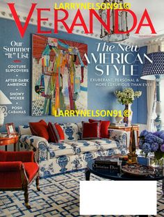 a living room with blue walls and white furniture on the cover of veranda magazine