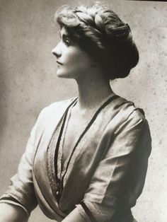 an old black and white photo of a woman