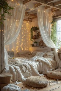 a bedroom with white curtains and lights on the ceiling