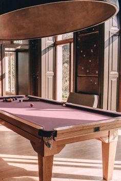 a pool table in the middle of a room