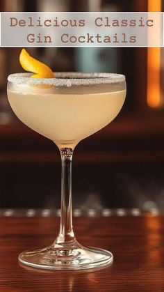 a close up of a drink in a glass on a table with the words delicious classic gin cocktails