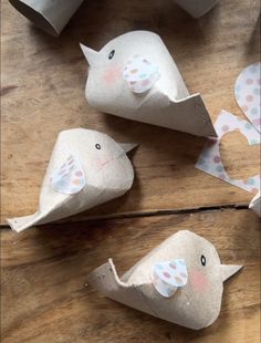 some paper birds are sitting on the table