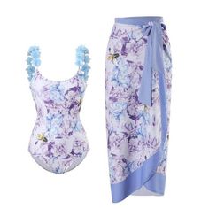 a women's swimsuit with blue flowers on the bottom and one piece under it