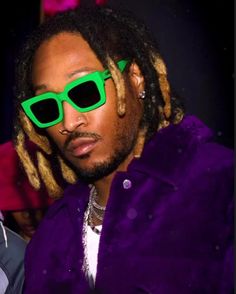 a man with dreadlocks wearing green sunglasses