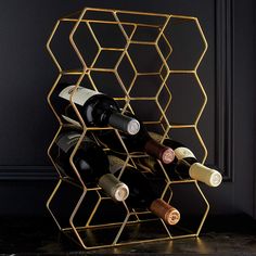 a wine rack with several bottles in it