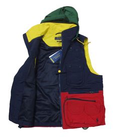 PLEASE NOTE: DUE TO HIGH VOLUME AND POST OFFICE DELAYS, DELIVERY TIMES MAY BE LONGER THAN NORMAL. ALL SALES ARE FINAL. NO RETURNS ACCEPTED. POLO RALPH LAUREN  NAVY MULTI COLORBLOCK NYLON UTILITY VEST FEATURES 12 POCKETS ON THE FRONT OF THE GARMENT WITH AN ADDITIONAL 4 POCKETS ON THE BACK CONTRASTING COLORS THROUGHOUT THE ICONIC EMBROIDERED LOGO ON THE FRONT WITH A FULL ZIP FASTENING AND SINGLE POPPER SLEEVELESS ATTACHED DRAWSTRING HOOD 100% NYLON MACHINE WASHABLE IMPORTED RALPH LAUREN MEN’S BIG Mens Fashion Accessories, Utility Vest, Hooded Vest, Ralph Lauren Mens, Mens Accessories Fashion, Mens Navy, Cardigan Jacket, Polo Ralph Lauren Mens, Blazer Coat