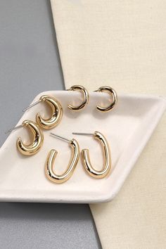 An elegant charming unique must have trending pair of earrings that is made into a mini trio hoop earrings set design. .Perfect for casual events with on your dresses or denim shorts.DIMENSION length: .75" - .5"width: .5" earring back: postmetal finish: Gold Platingproduct: Lead & Nickel Compliantanti-tarnish: Double E-coating Post Metal, Earring Sets, Mini Hoop Earrings, Wall Accessories, Hoop Earring Sets, Huggie Hoop Earrings, Dainty Jewelry, Set Design, Earring Backs