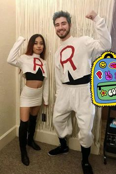 a man and woman dressed in costumes posing for a photo with the letter r on their chest