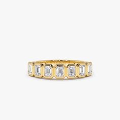 "14k Bezel Setting Emerald Cut Diamond Wedding Band / Emerald Cut Wedding Band 0.75 Ctw Genuine Emerald Cut Diamond Anniversary Ring by Ferko's Fine Jewelry Gold Kt: 14K (Please message me if you want 18K) Custom Gold Color: Rose Gold, Yellow Gold, White Gold EmeraldCut Diamond: 7 pcs 3.5 x 2.5 MM Total CTW: 0.75 CTW Ctw Diamond Color-Clarity: G Color Si Clarity Setting Type: Bezel Band Width: Starts off at 3MM and graduates down to 2MM If you have any additional questions about this ring, just Bezel Diamond Band, Classic Emerald Cut Half Eternity Jewelry, Bezel-set Baguette Cut Diamond Ring, Anniversary Diamond Ring With Single Cut Octagon Diamonds, Yellow Gold Baguette Cut Diamond Ring With Bezel Setting, Gold Lab-grown Diamond Eternity Band For Anniversary, Anniversary Diamond Ring With Octagon Shape, Baguette Cut Diamond Ring With Bezel Setting, Yellow Gold Emerald-cut Diamond Ring With Channel Set