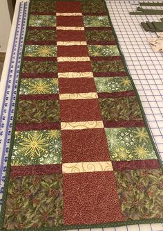 a quilted table runner on top of a cutting board