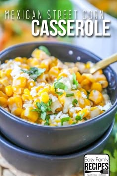 mexican street corn casserole in a blue bowl with a wooden spoon on the side