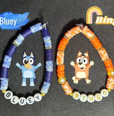 two bracelets with cartoon characters on them sitting next to each other and the words bingen spelled out in small letters