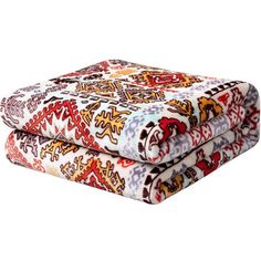 two colorful bedspreads sitting on top of each other