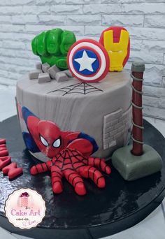 a birthday cake decorated to look like the avengerss