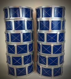 two large blue drum cases sitting next to each other