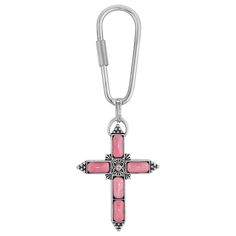 a pink cross shaped charm on a white background