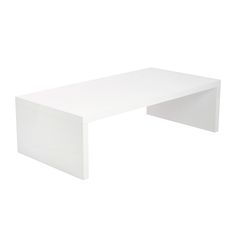 a white table sitting on top of a white floor