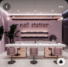 the interior of a nail salon with pink chairs and white counter tops, along with neon lights