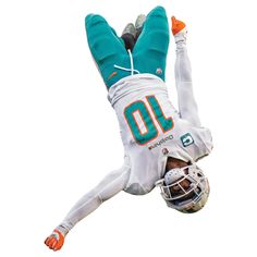 a football player is in the air with his feet up