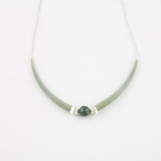 This beautiful necklace has 1 green jade beads and two dentalium shells strung with sterling silver tubes. The Dentalium shells were traded widely throughout the Americas and Asia as early as 10,000 B.C. In North America Dentalium shells were harvested from the ocean floor by tribes of the Pacific Coast, centering around the vecinity of what is today British Columbia. These valued shells were traded throughout areas ranging as far east to Ohio and Michigan and to Southern California. These covet Green Sterling Silver Beaded Necklace With Silver Beads, Ocean Floor, Single Bead, Jade Necklace, White Jade, Bead Stringing, Jade Beads, Pacific Coast, Green Jade