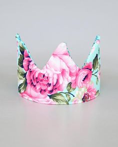 Encourage creative play or celebrate a birthday with this fanciful sequined crown featuring a reversible design for double the fun. Adjustable tie to fit everyone.15.5'' W x 5'' HPolyester / cotton / sequinsSpot clean Whimsical Adjustable Pink Crown, Whimsical Pink Crown For Birthday, Adjustable Pink Crown With Round Shape, Pink Pinched Crown For Party, Roses Crown, Sequin Mask, White Sequin Dress, Purple Romper, Crown Birthday